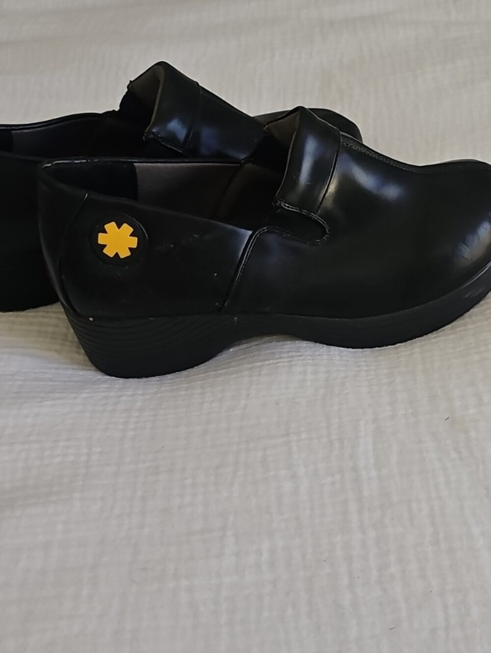 Dansko Black Slip-On Clog with Yellow Logo Accent